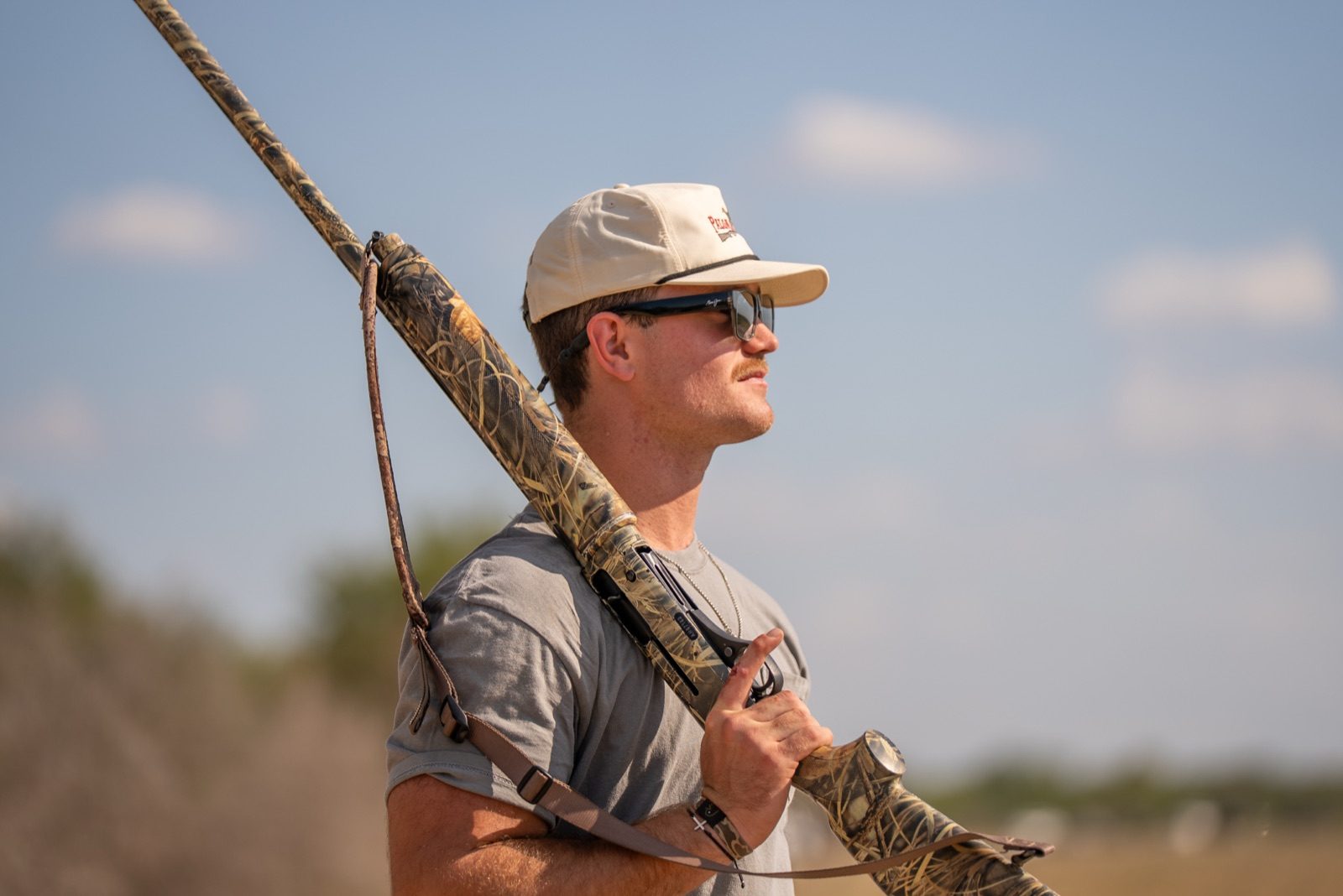 Hunter Mazour outdoors with hunting equipment